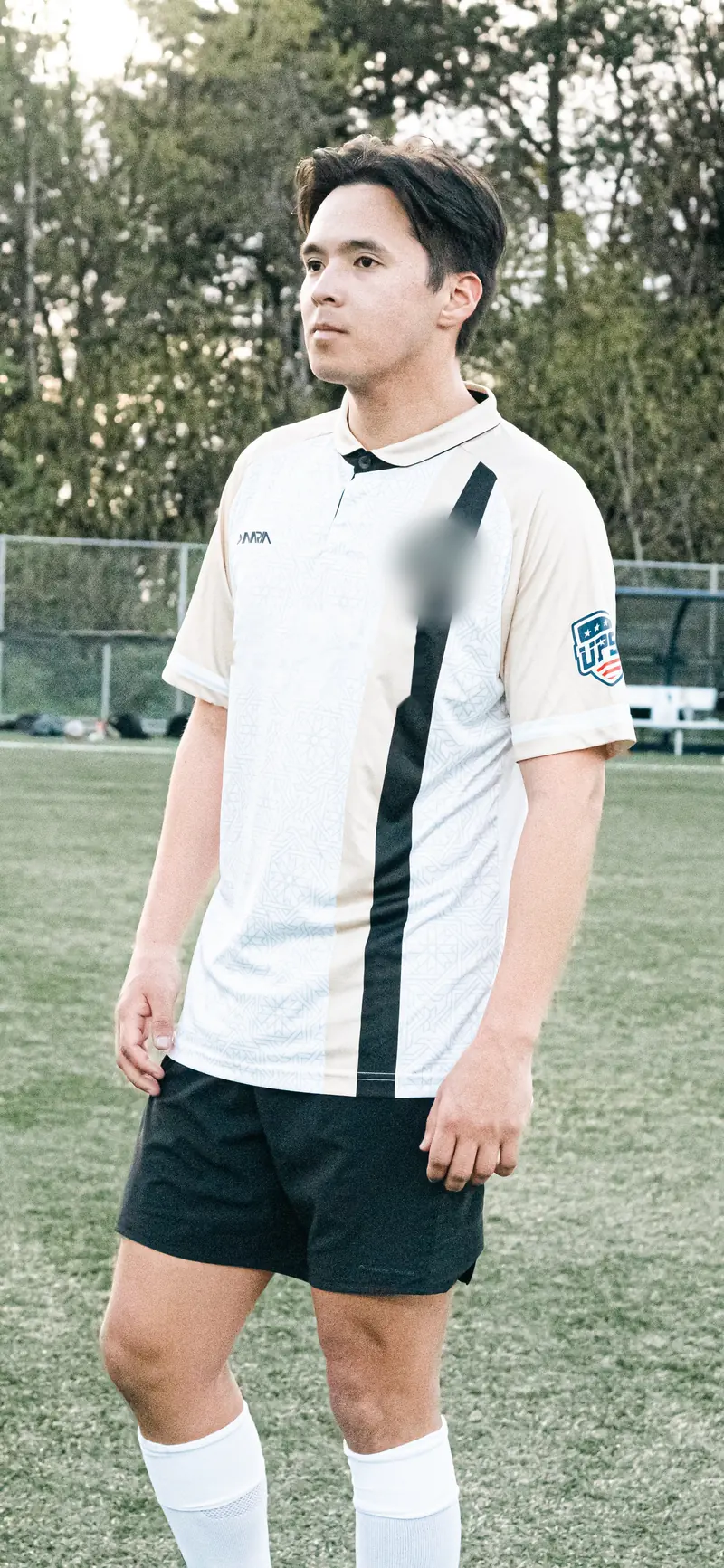 Marat in kit on the pitch before a match, focused